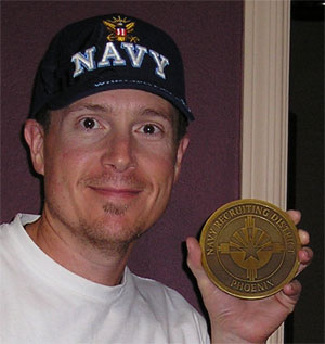 Spartancoins.com owner Robert D. Blackburn with a huge custom navy medallion.